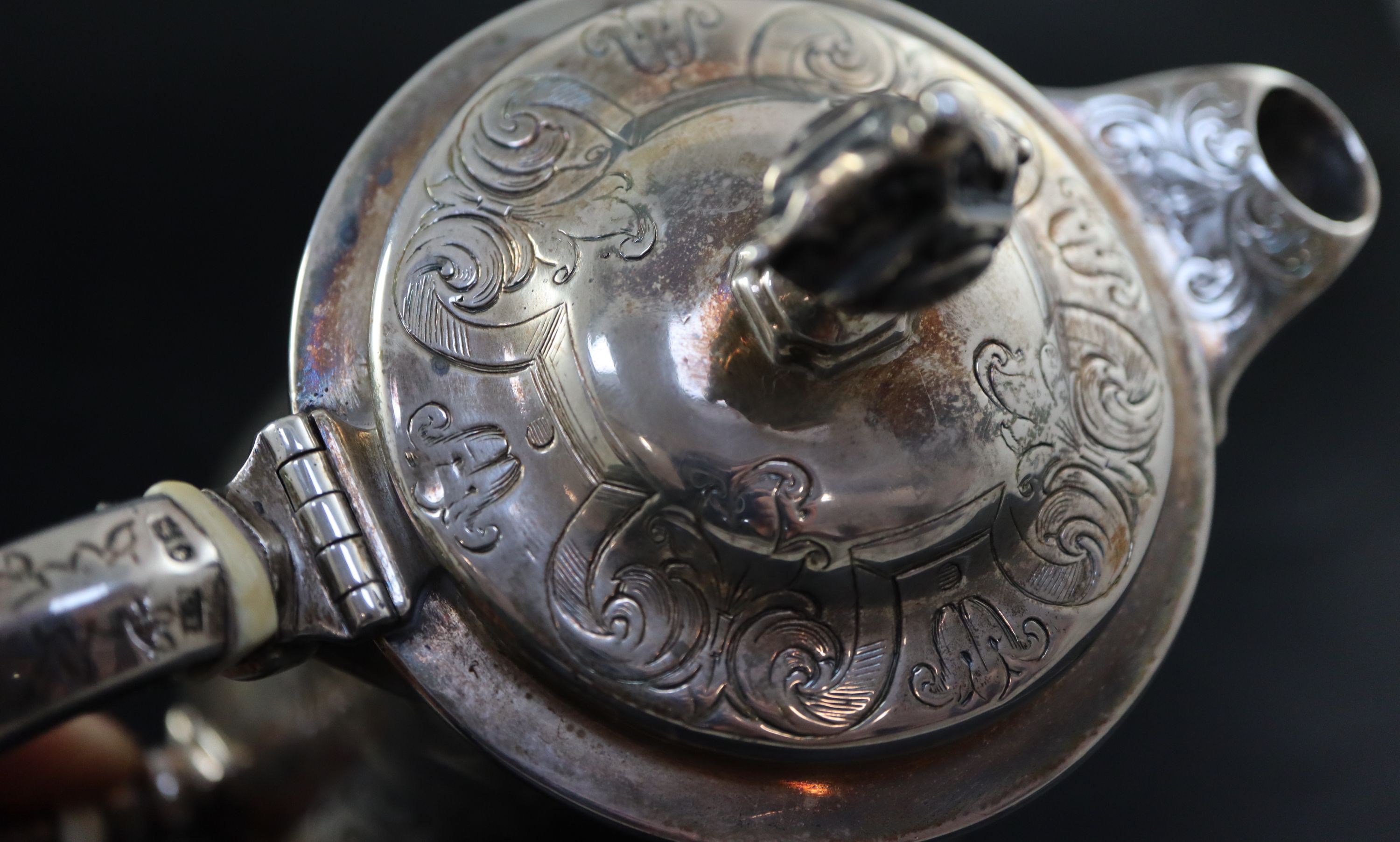 A Victorian small engraved silver hot water pot, 5.7cm, gross 10.5oz.